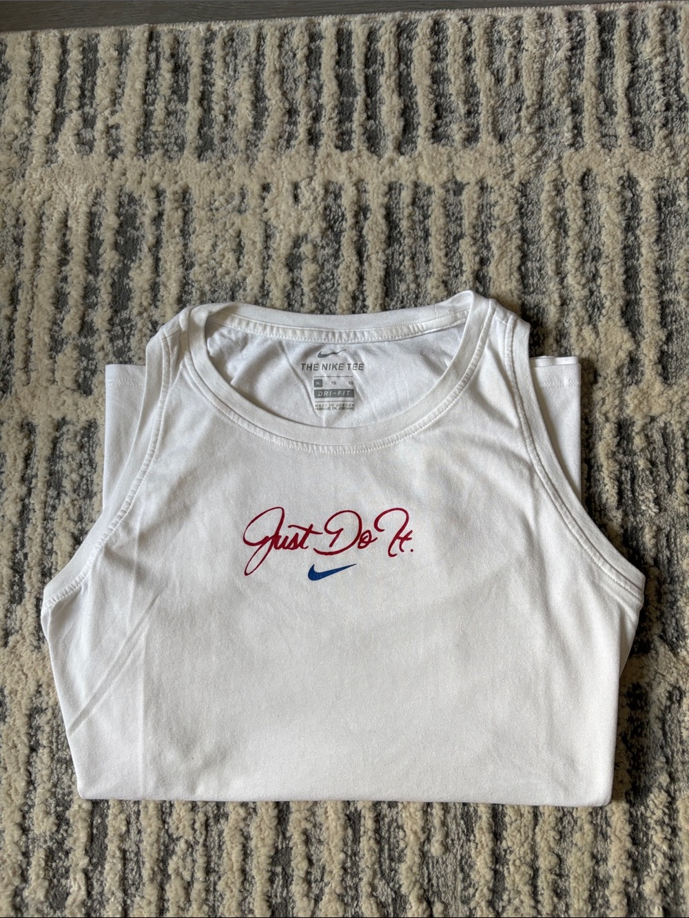 Nike Women’s White Sleeveless Top with Red "Just Do It." Script and Blue Swoosh